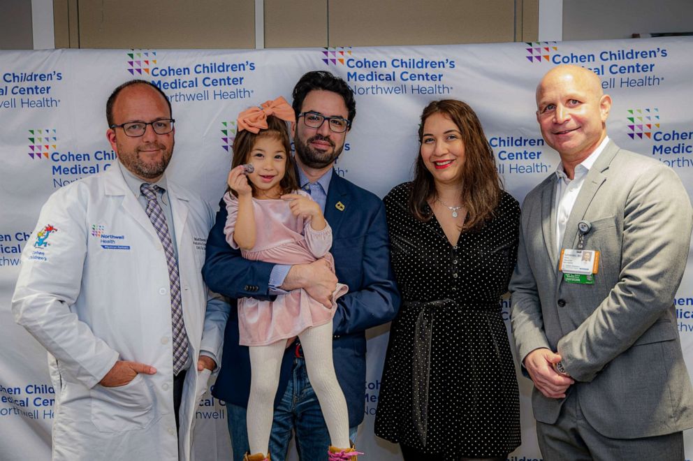 PHOTO: Ella Rose Ghiam, 3, poses with her parents and medical team at Cohen Children's Medical Center.
