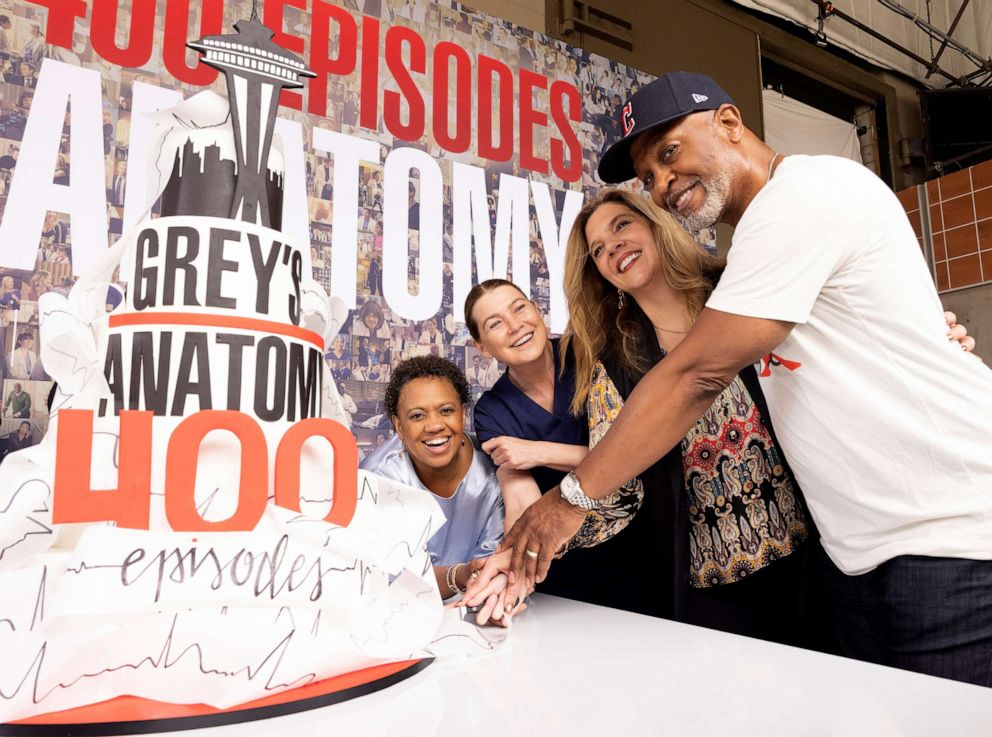 PHOTO: In this May 2, 2022, file photo, Chandra Wilson, Ellen Pompeo, Krista Vernoff, and James Pickens, Jr., celebrate the 400th episode milestone of "Grey's Anatomy," with a cake-cutting ceremony on the set in Los Angeles.