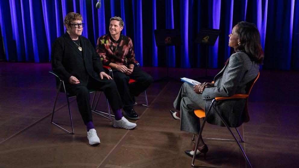 PHOTO: Elton John and Jake Shears appear in this image with ABC News’ Deborah Roberts