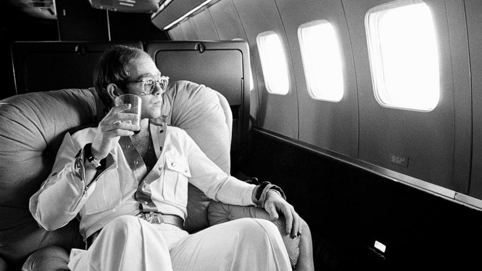 PHOTO: Elton flies on his private Boeing 720 airplane known as "The Starship" during his 1974 tour.