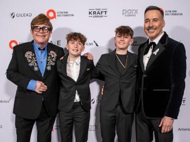 Elton John attends annual Oscars viewing party with husband, kids: Photos