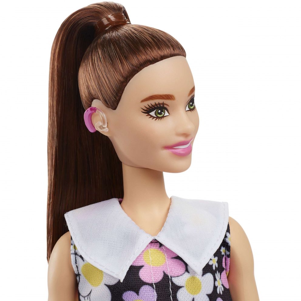 Mattel has revealed its 2022 lineup of its Barbie Fashionista dolls that includes its first doll with visible behind-the-ear hearing aids. 