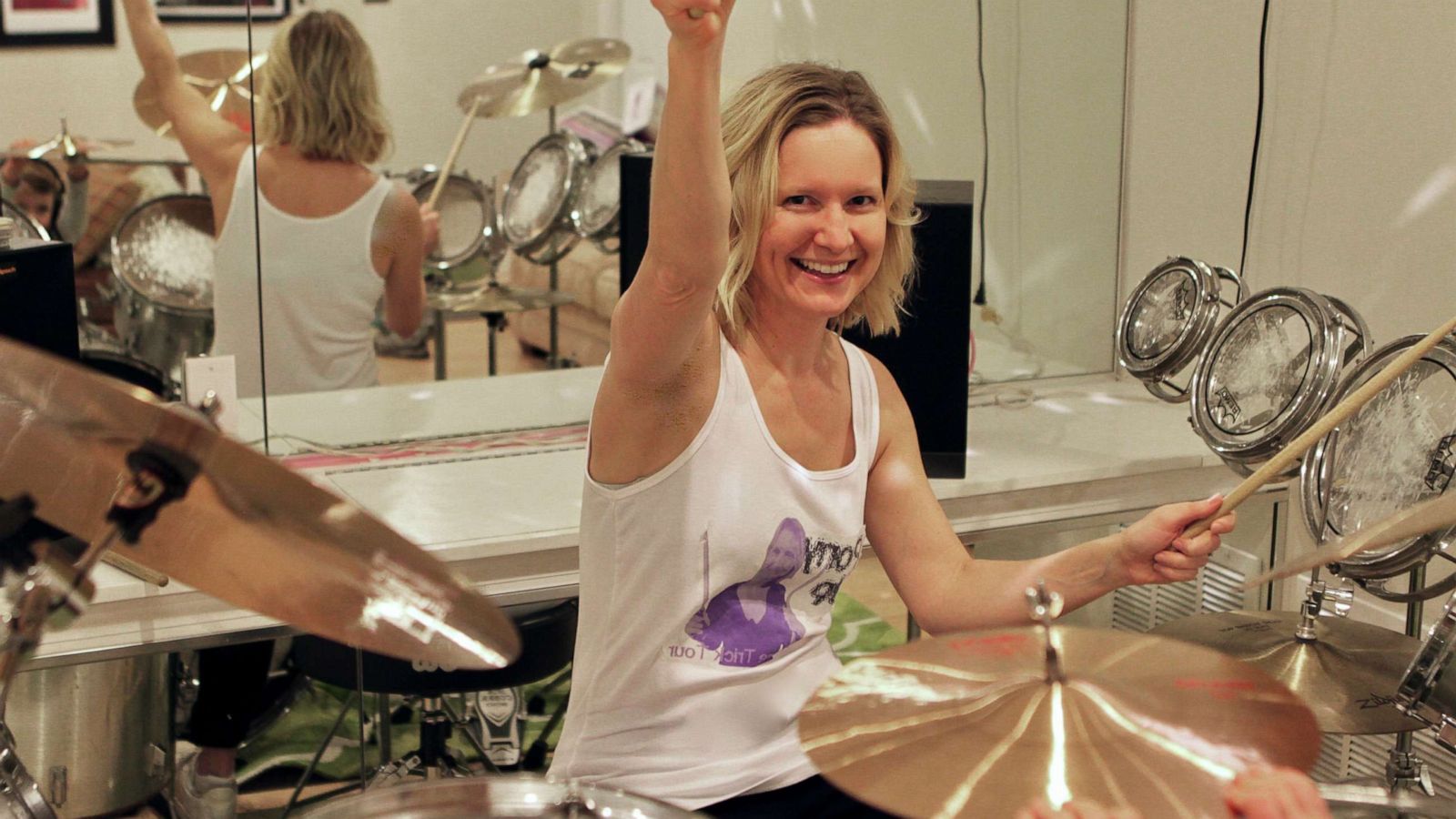 PHOTO: Author Emily Balcetis practices playing the drums. She set a goal for herself to lean how to play at least one song on the instrument.