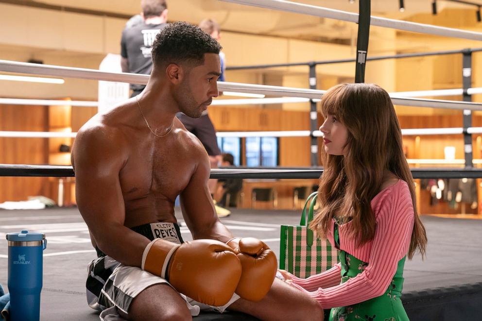 PHOTO: Lucien Laviscount as Alfie, Lily Collins as Emily in Emily in Paris. 