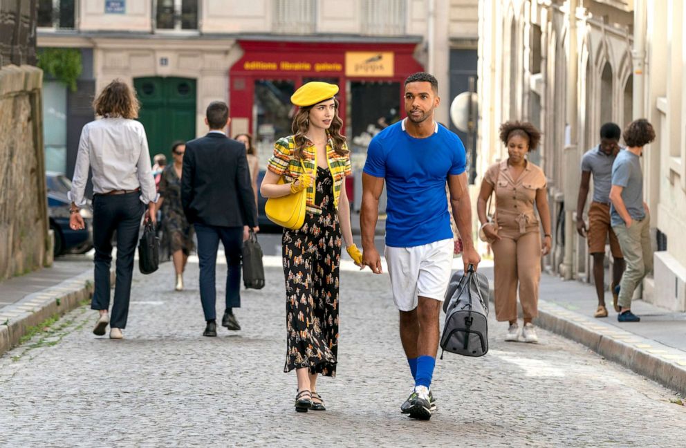 PHOTO: Lily Collins as Emily and Lucien Laviscount as Alfie are pictured in episode 209 of "Emily in Paris" on  Netflix.