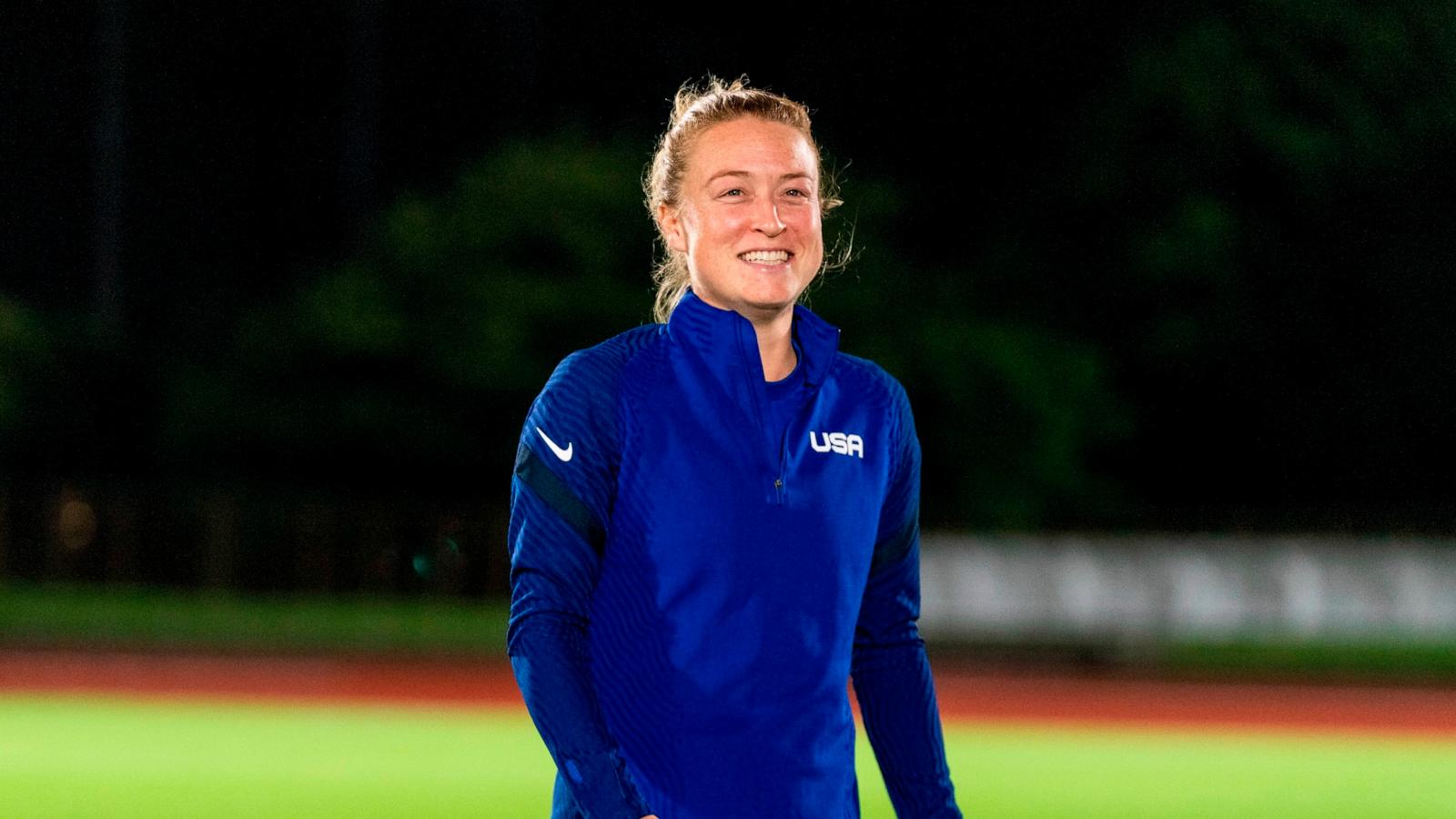 PHOTO: Emily Sonnett #14 of the USWNT talks to her teammates before a training session at the practice fields on July 29, 2021 in Tokyo, Japan.