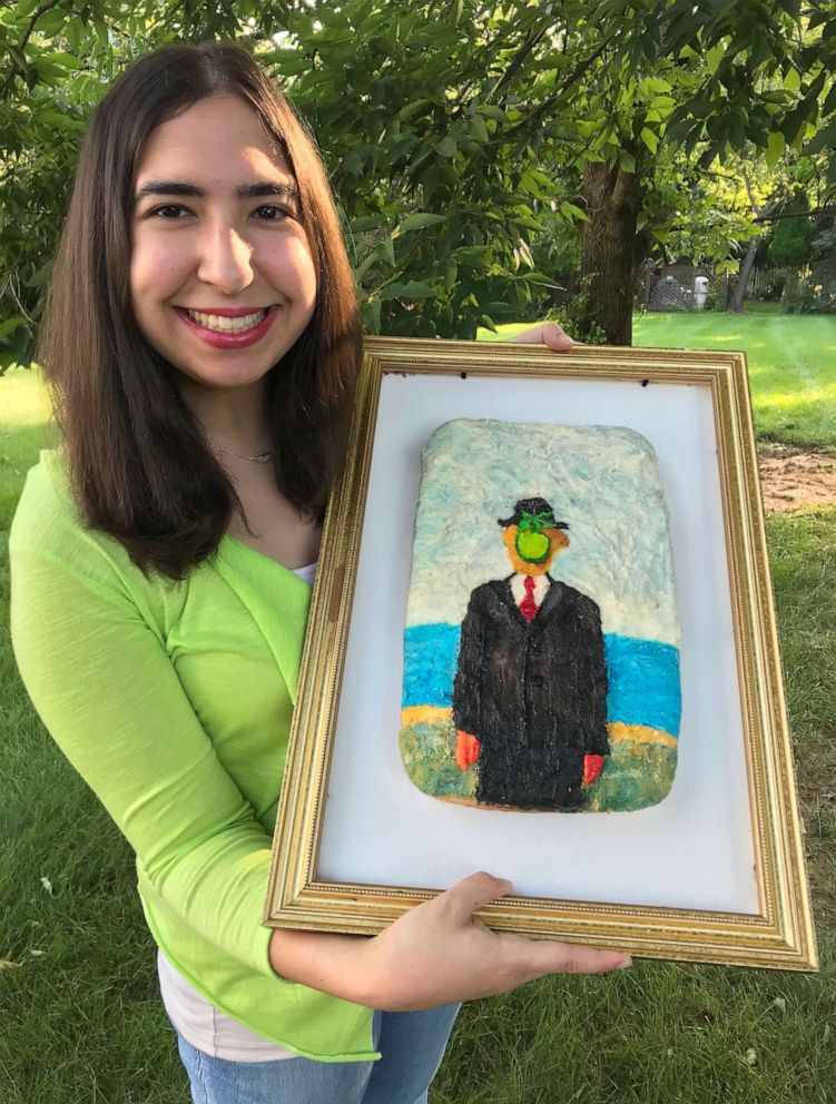PHOTO: Emily Zauzmer holds up her cake recreation of  René Magritte's painting, "Son of Man."