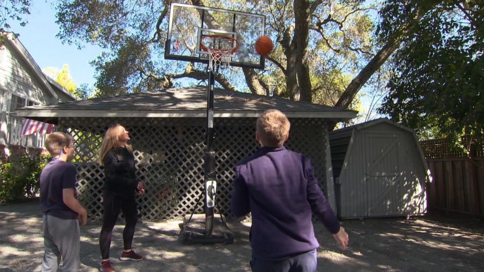 PHOTO: Emma McCulloch plays basketball with her two sons outside their San Francisco-area home.