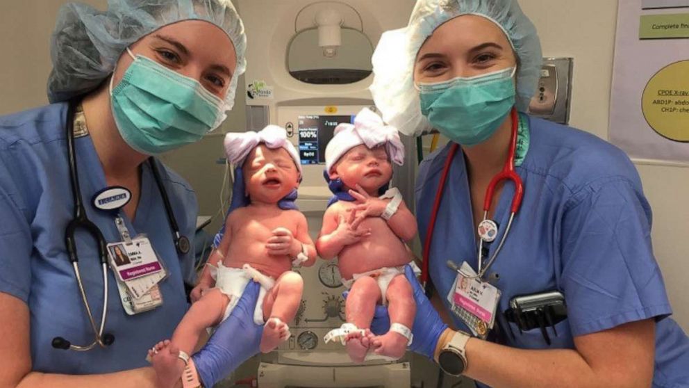 PHOTO: Nurses Emma Anderson and Julia Van Marter hold twins Emma and Julia Meehan. The nurses cared for the twins at HCA Healthcare's Rose Medical Center in Denver.

