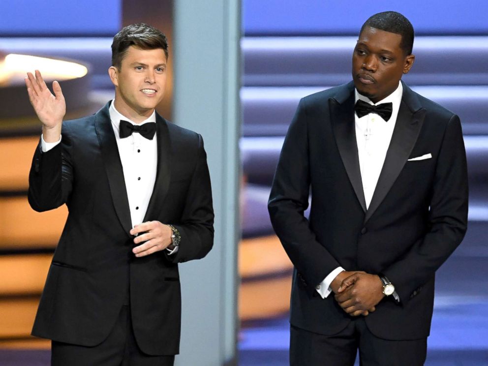 PHOTO: Colin Jost (L) and Michael Che speak onstage during the 70th Emmy Awards at on Sept. 17, 2018, in Los Angeles.
