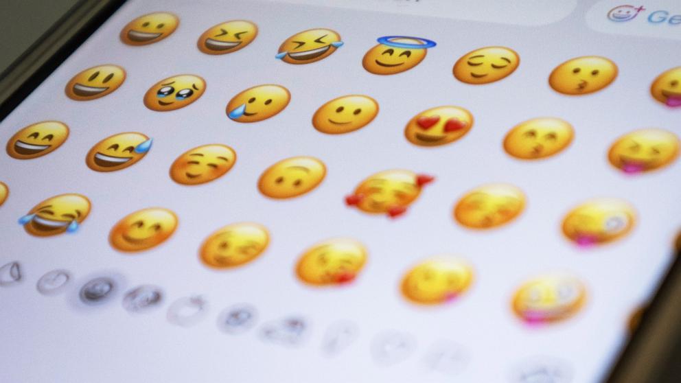 PHOTO: The emoji keyboard is open on a smartphone. 