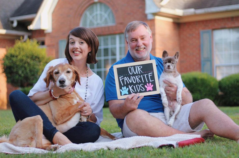 PHOTO: Amy and Randy English pose at their home in Pontotoc, Miss., pose with their dogs, Marley and Buck during an "empty nesters" photo shoot. 