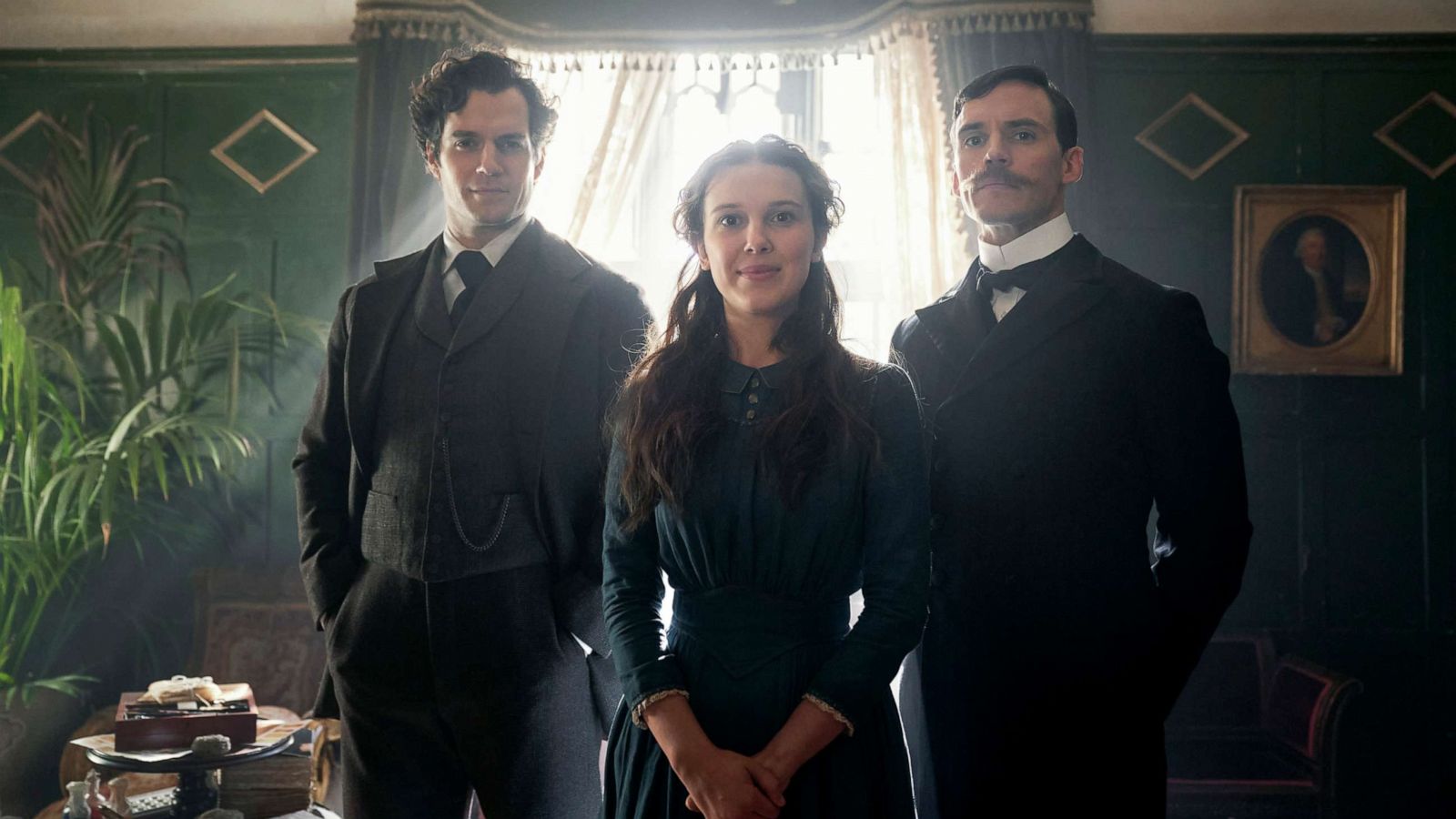 PHOTO: Henry Cavill, as Sherlock Holmes, Millie Bobby Brown, as Enola Holmes, and Sam Claflin, as Mycroft Holmes in a scene from "Enola Holmes."