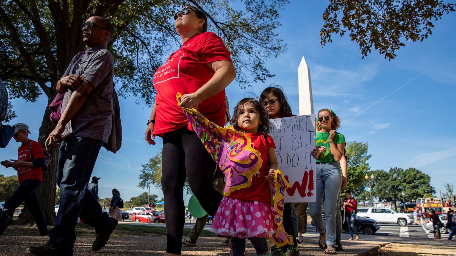 PHOTO: Mothers and their children with Moms Clean Air Force walk to meet up with other protesters for the Global Climate Strike protests, Sept. 20, 2019, in Washington, DC.