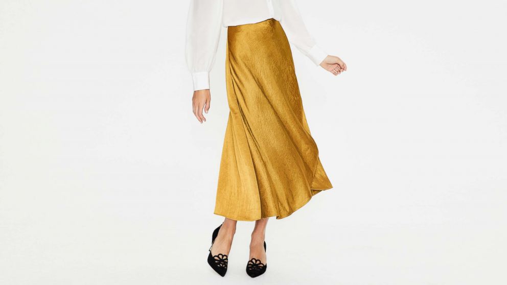 Midi skirts are easy to incorporate into your daily wardrobe. Pictured: The Epsom Midi Skirt from Boden.