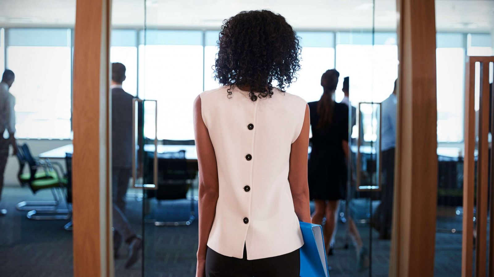 PHOTO: A Black businesswoman enters a boardroom for a business meeting in an undated stock image.