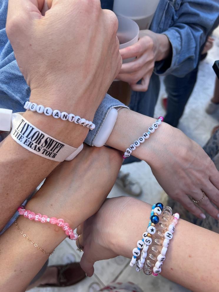 PHOTO: Katherine McCall shows off friendship bracelets worn with family and friends at Taylor Swift's Eras Tour concert in Portugal.