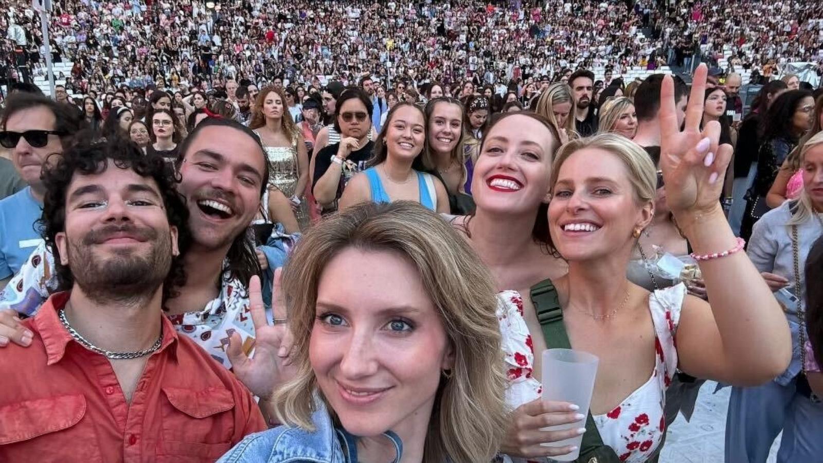 PHOTO: Taylor Swift fan Katherine McCall holds up a peace sign with her sister-in-law and friends at the Eras Tour in Lisbon, Portugal.