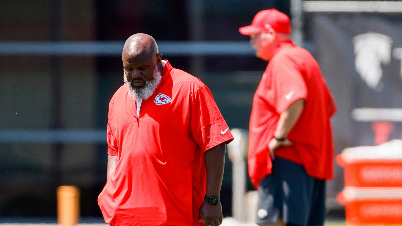 PHOTO: Kansas City Chiefs offensive coordinator Eric Bieniemy, left, walks upfield during the second day of the NFL football team's rookie minicamp in Kansas City, Mo., May 2, 2026.
