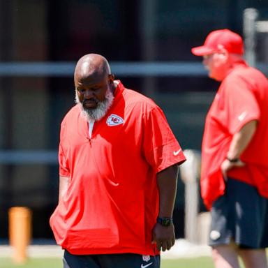 PHOTO: Kansas City Chiefs offensive coordinator Eric Bieniemy, left, walks upfield during the second day of the NFL football team's rookie minicamp in Kansas City, Mo., May 2, 2026.