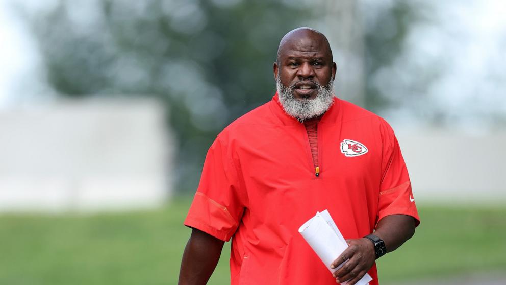 PHOTO: Offensive coordinator Eric Bieniemy walks toward the practice field during Kansas City Chiefs training camp at Missouri Western State University on July 25, 2026 in St Joseph, Missouri.