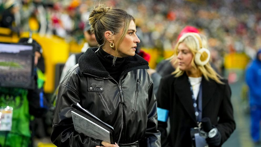 PHOTO: Fox Sports NFL reporter Erin Andrews walks behind the bench during the first half of an NFL football game against the San Francisco 49ers, at Lambeau Field, on Nov. 24, 2024, in Green Bay, Wisconsin. 