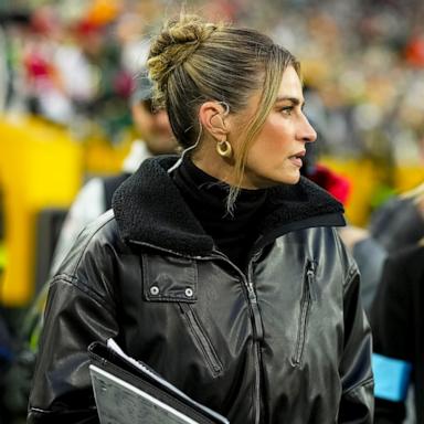 PHOTO: Fox Sports NFL reporter Erin Andrews walks behind the bench during the first half of an NFL football game against the San Francisco 49ers, at Lambeau Field, on Nov. 24, 2024, in Green Bay, Wisconsin. 