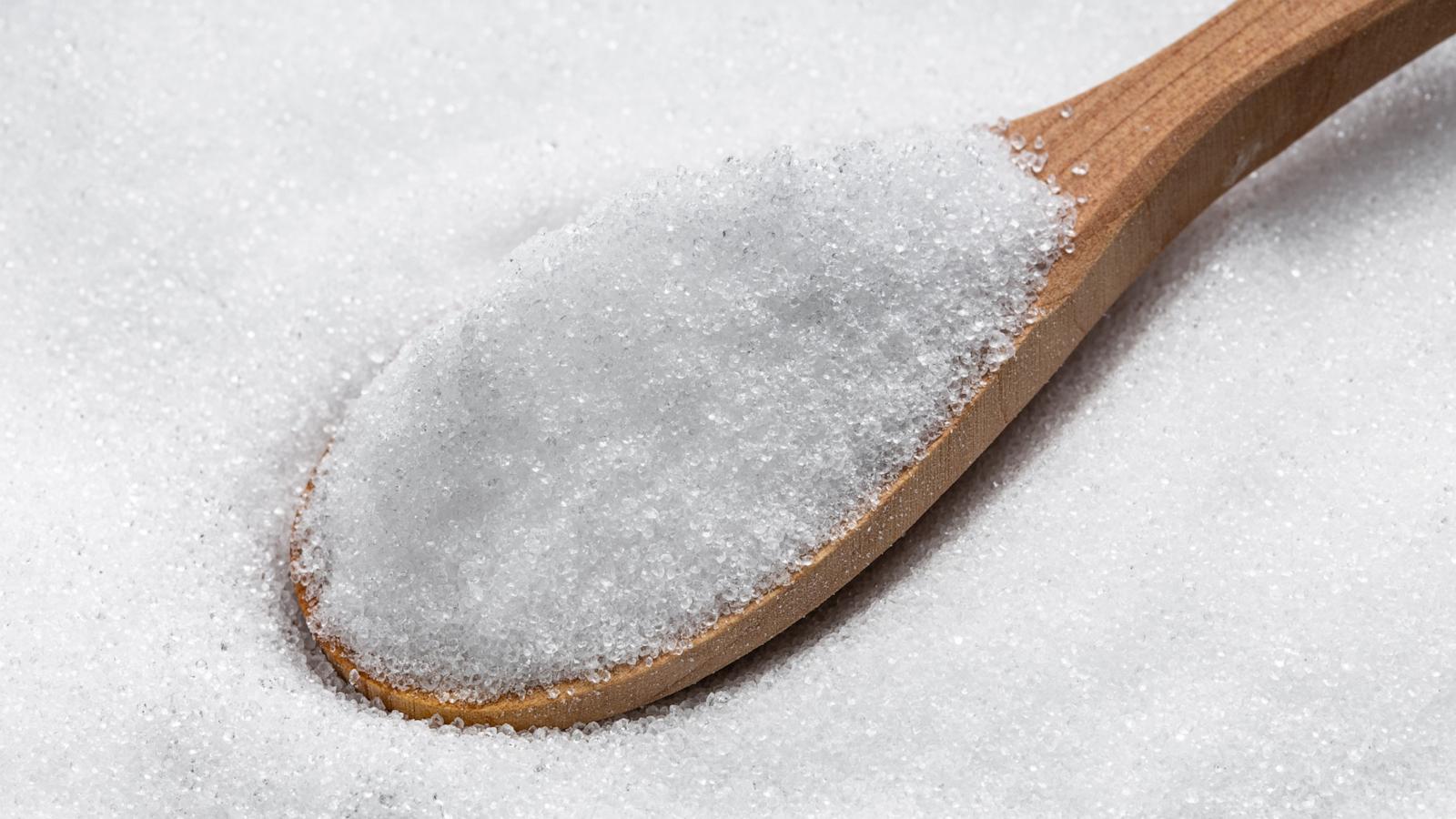 PHOTO: View of wooden spoon with crystalline erythritol, a sugar substitute.