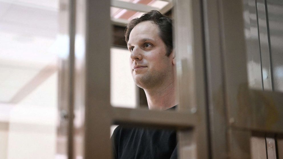 PHOTO: US journalist Evan Gershkovich, arrested on espionage charges, stands inside a defendants' cage before a hearing to consider an appeal on his extended detention at The Moscow City Court in Moscow on June 22, 2023.