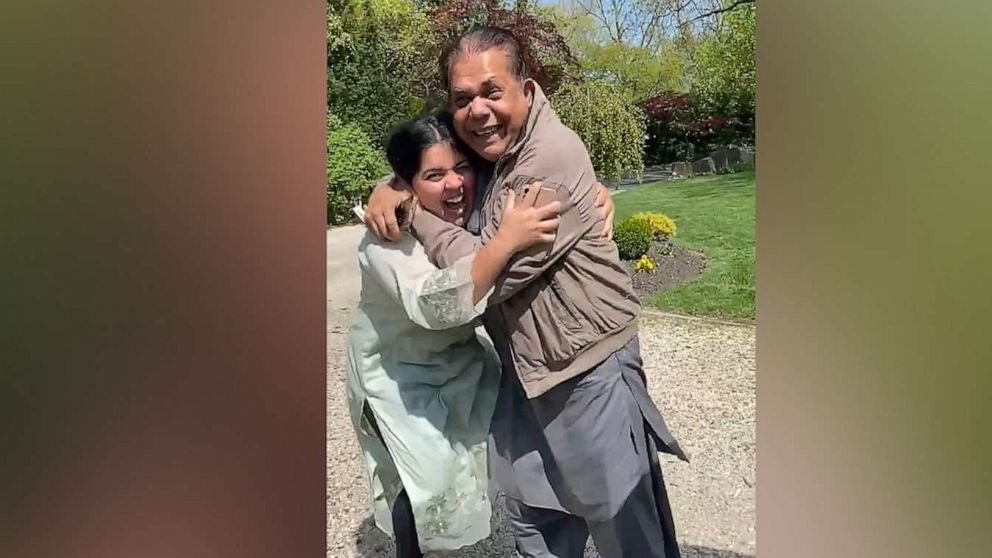 PHOTO: Hibah Ansari in Hewlett, New York, shows her sister, Sana being embraced by her father after telling him she'd passed the bar exam.