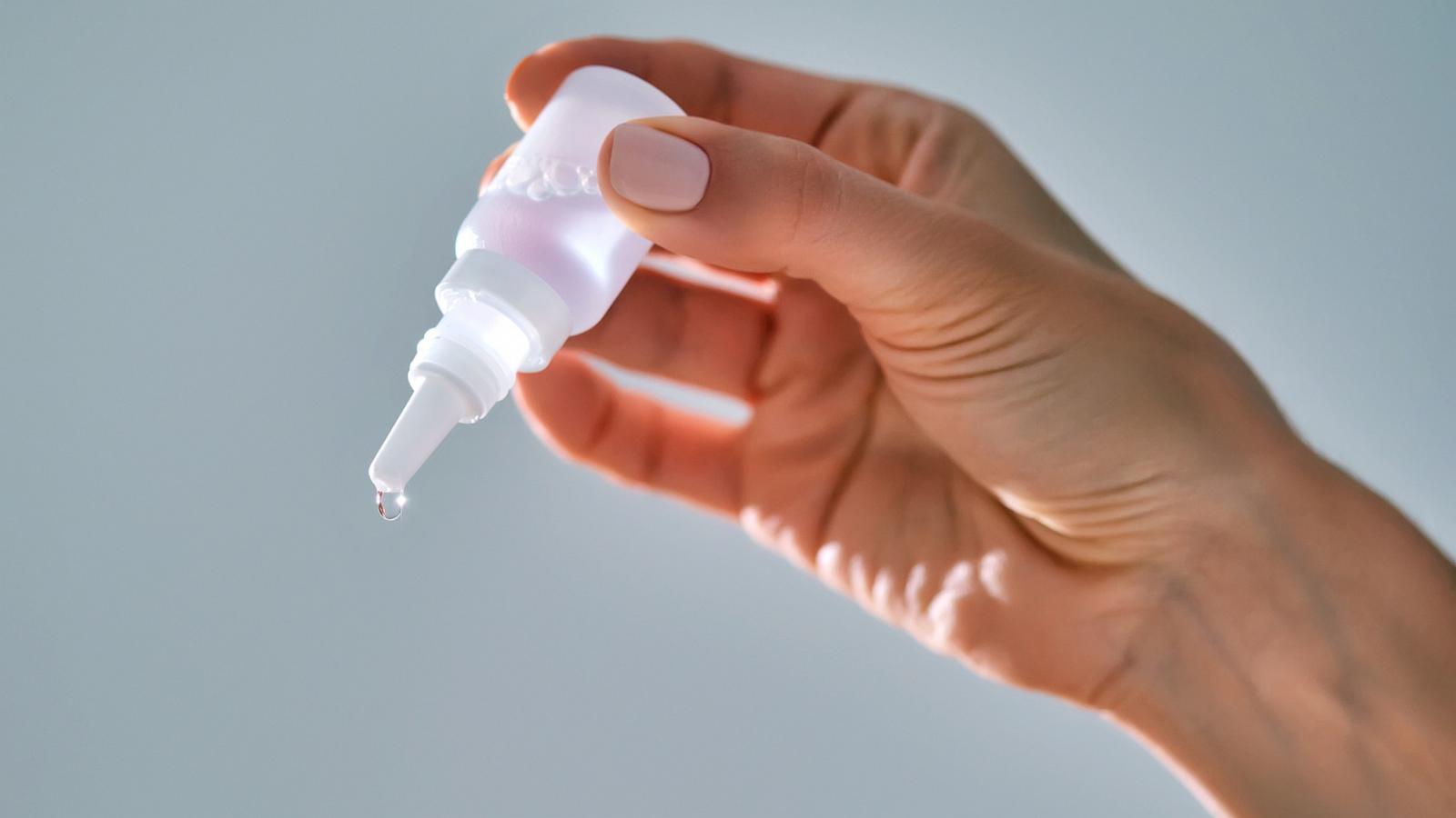 PHOTO: Stock photo of a person using eye drops.