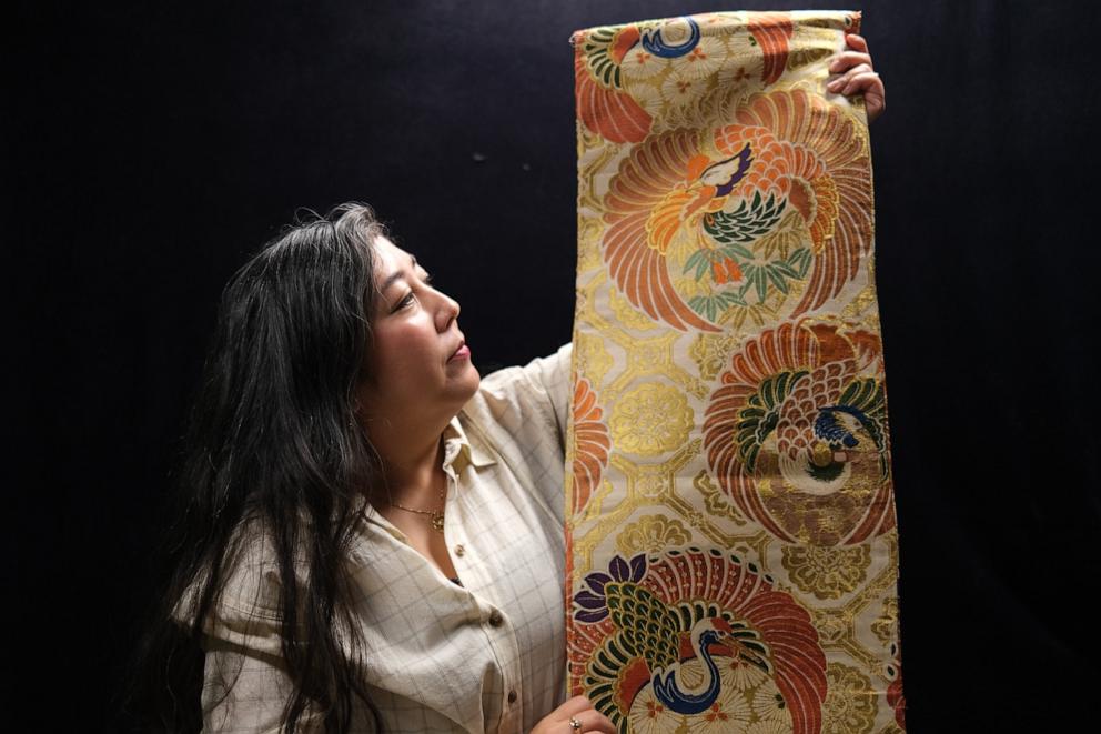 PHOTO: Caitlin Oiye Coon holds her grandmother Shizuko Kikuchi Oiye’s wedding obi, which she said her grandma likely wore when she married her husband Shigenori Oiye in Japan.