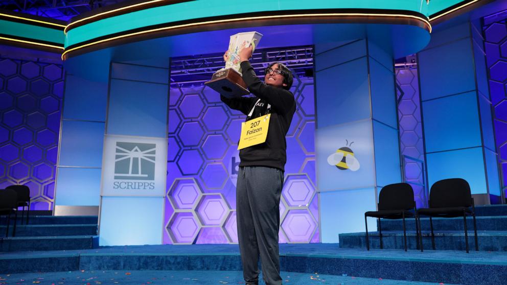PHOTO: Faizan Zaki, 13, of Dallas, Texas holds the Scripps Cup after winning in the 21st round of the 2025 Scripps National Spelling Bee at the Gaylord National Resort and Convention Center on May 29, 2025 in National Harbor, Maryland.