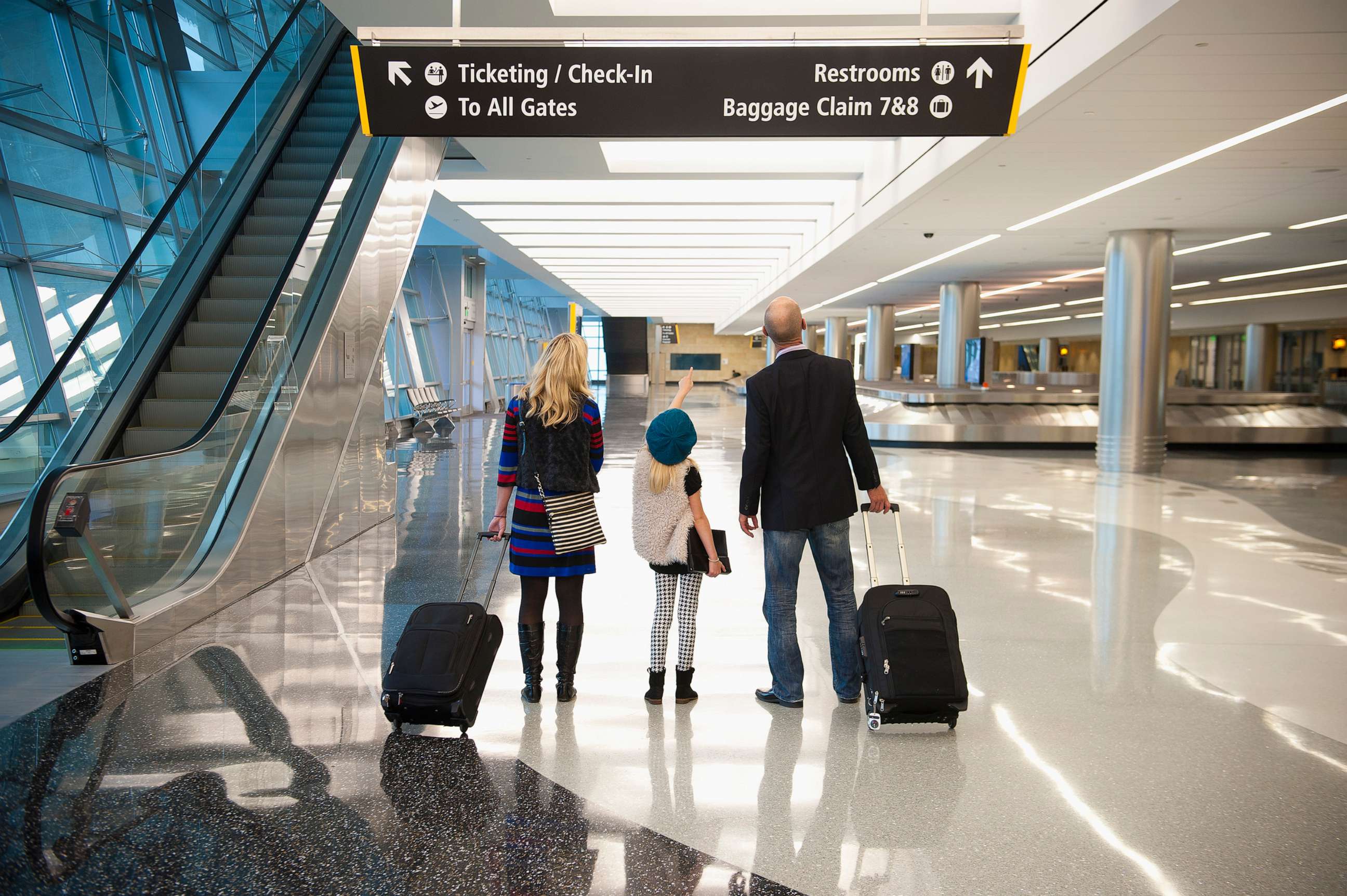 PHOTO: A stock photo shows a family together at an airport.