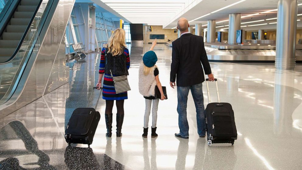 PHOTO: A stock photo shows a family together at an airport.