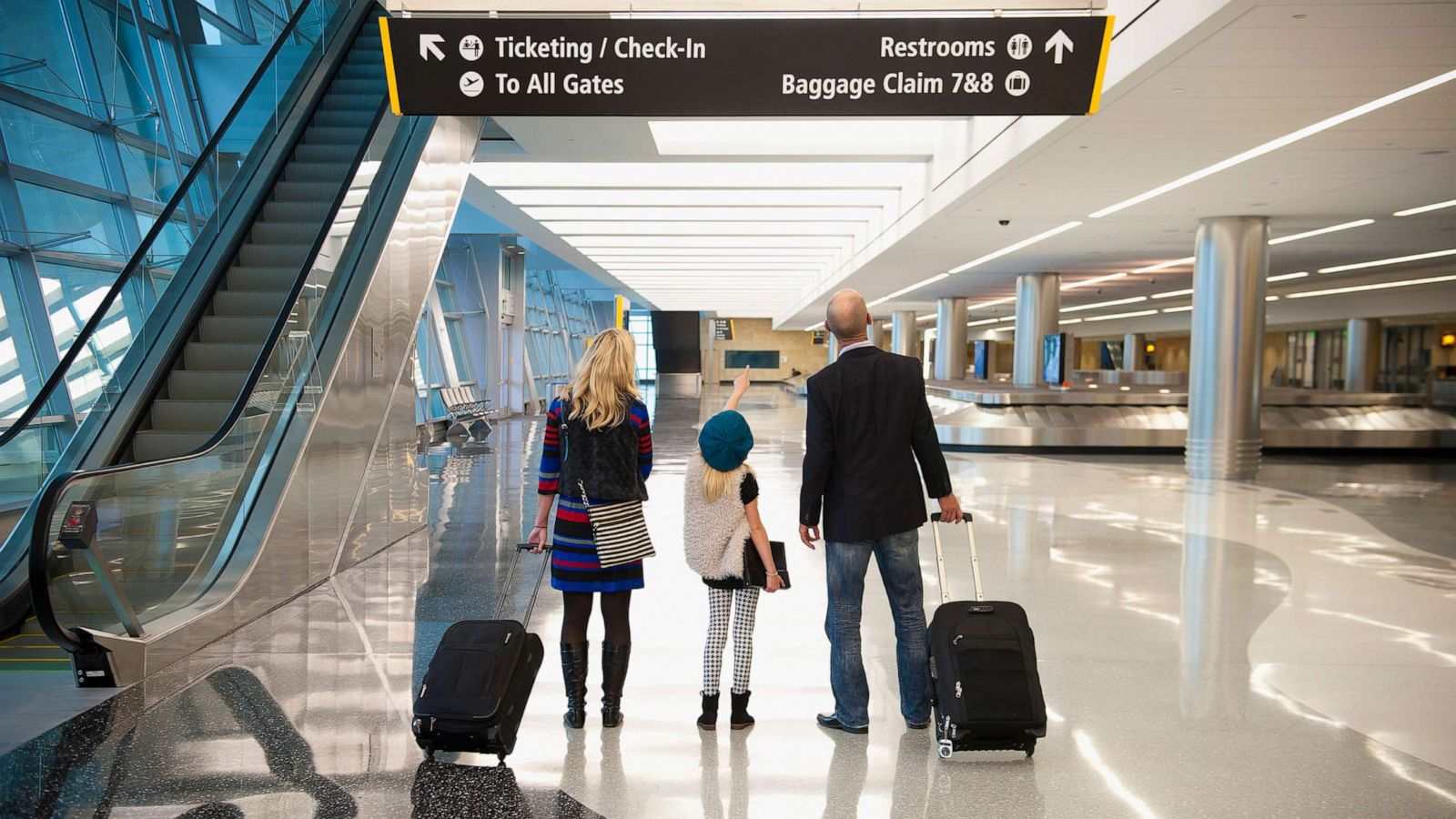 PHOTO: A stock photo shows a family together at an airport.