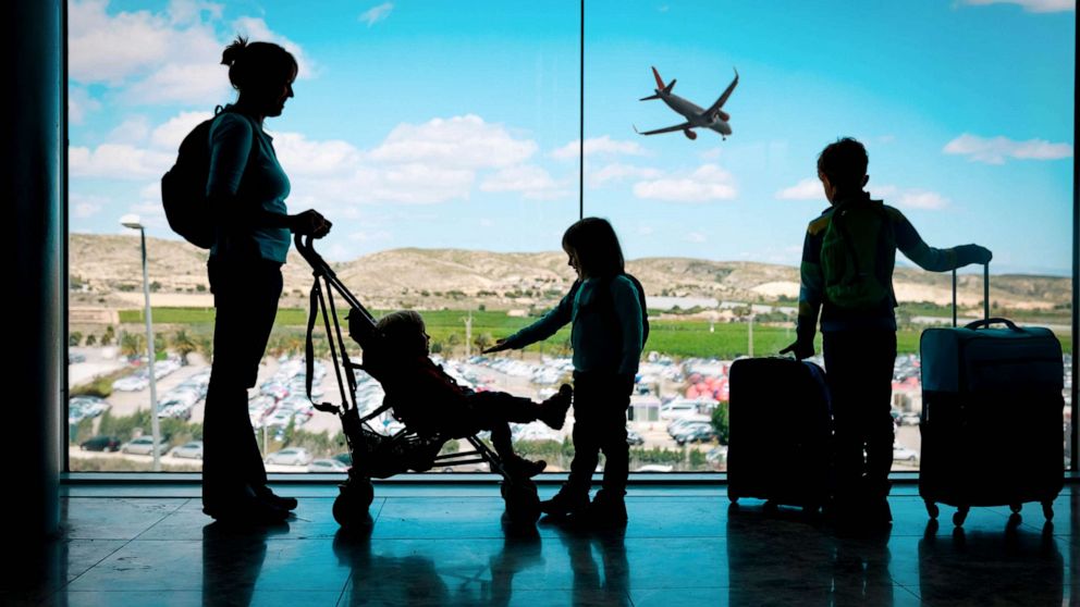 PHOTO: Stock photo of a family preparing to board a flight.