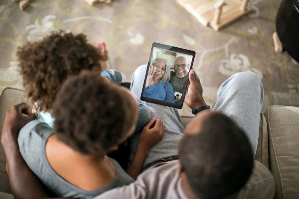 PHOTO: A family connects through a video chat in an undated stock photo.