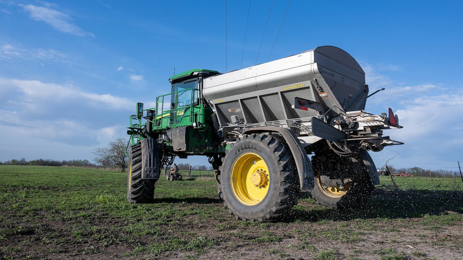PHOTO: Granular blend fertilizer is spread in a cattle pasture on a farm near Montrose, Missouri, April 7, 2026.