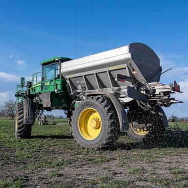 PHOTO: Granular blend fertilizer is spread in a cattle pasture on a farm near Montrose, Missouri, April 7, 2026.