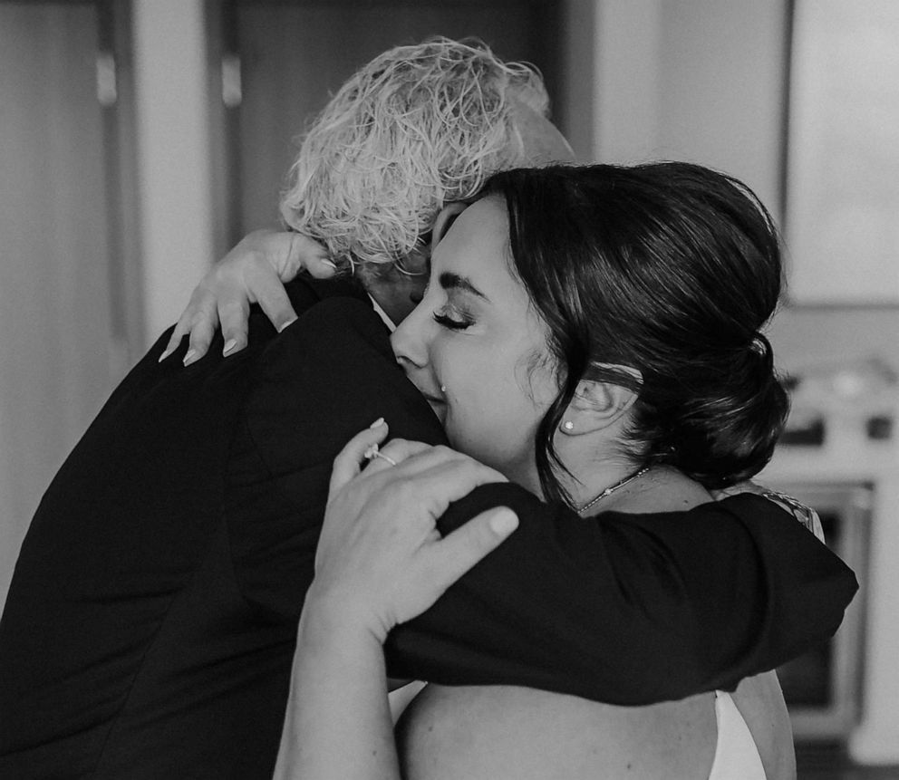 PHOTO: Ron Lestock and his daughter Nancy Krieger share a hug during their wedding ceremony on November 12.