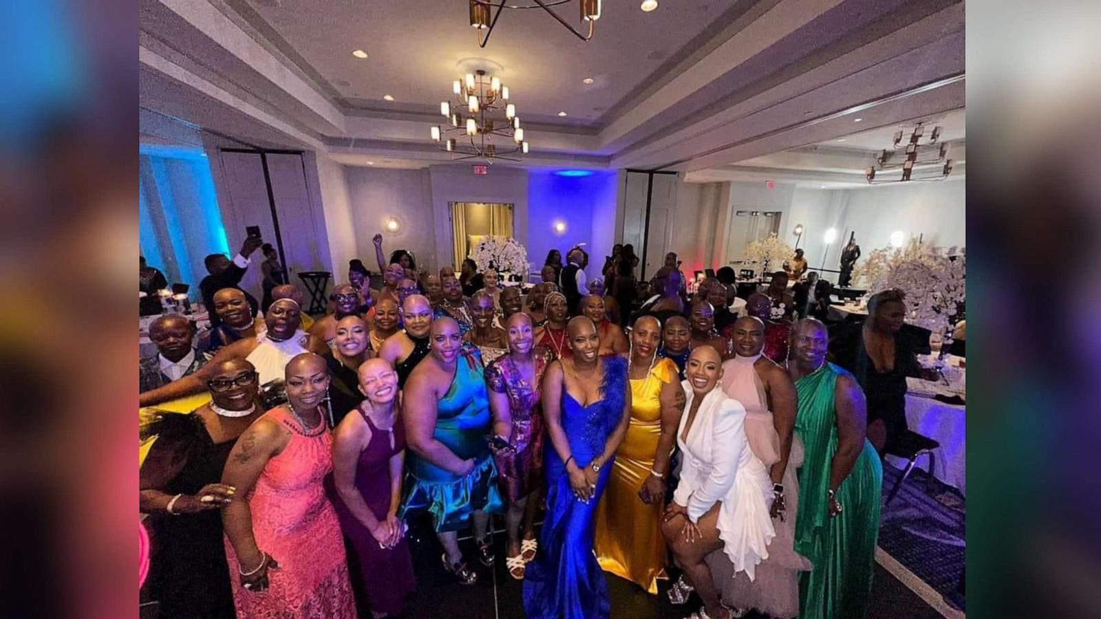 PHOTO: Felicia Flores, third from right, poses with attendees at the Baldie Con conference she founded.