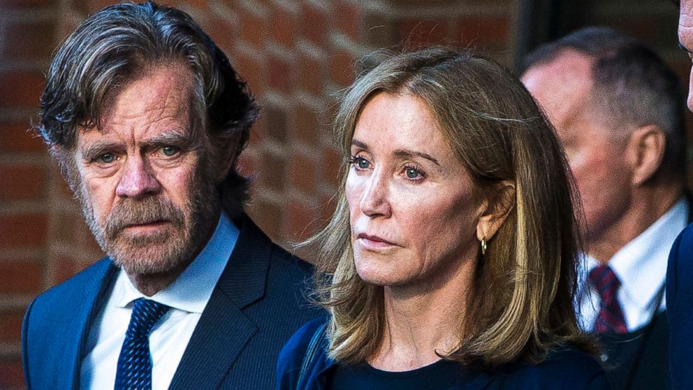 PHOTO: In this Sep. 13, 2019 file photo Felicity Huffman right, and her husband, William H. Macy, walk out of the John Joseph Moakley United States Courthouse in Boston. 