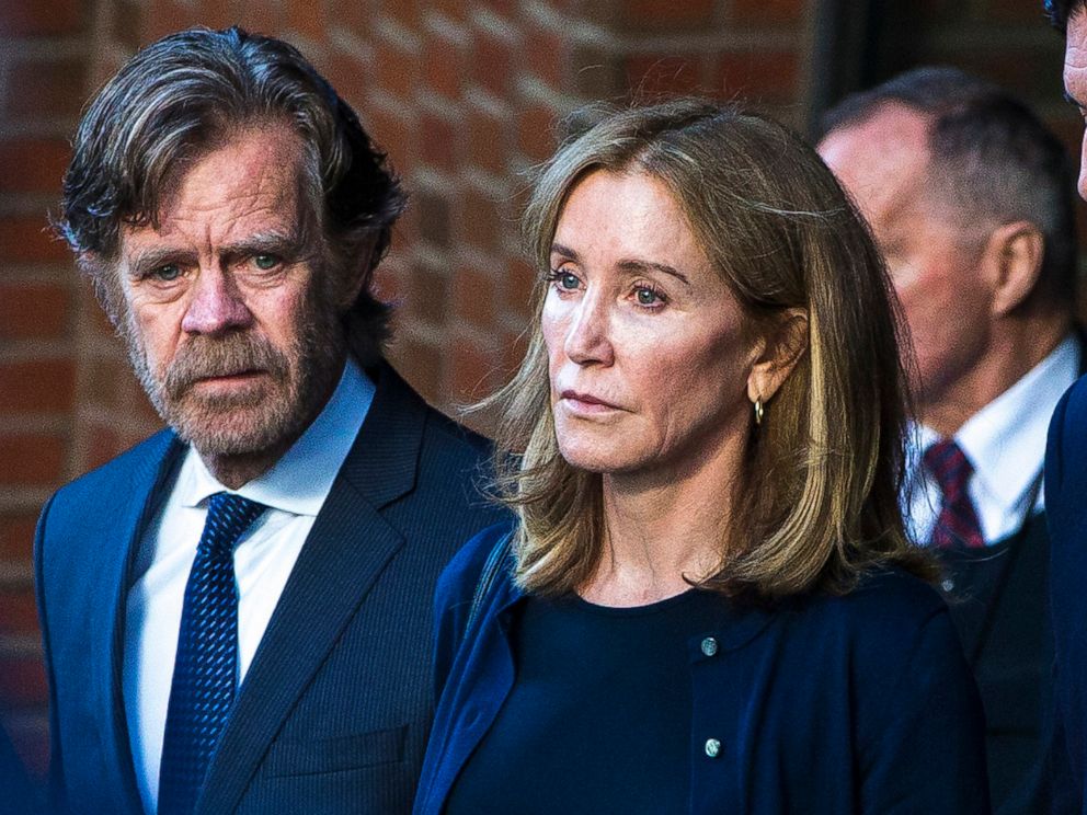 PHOTO: In this Sep. 13, 2019 file photo Felicity Huffman right, and her husband, William H. Macy, walk out of the John Joseph Moakley United States Courthouse in Boston. 