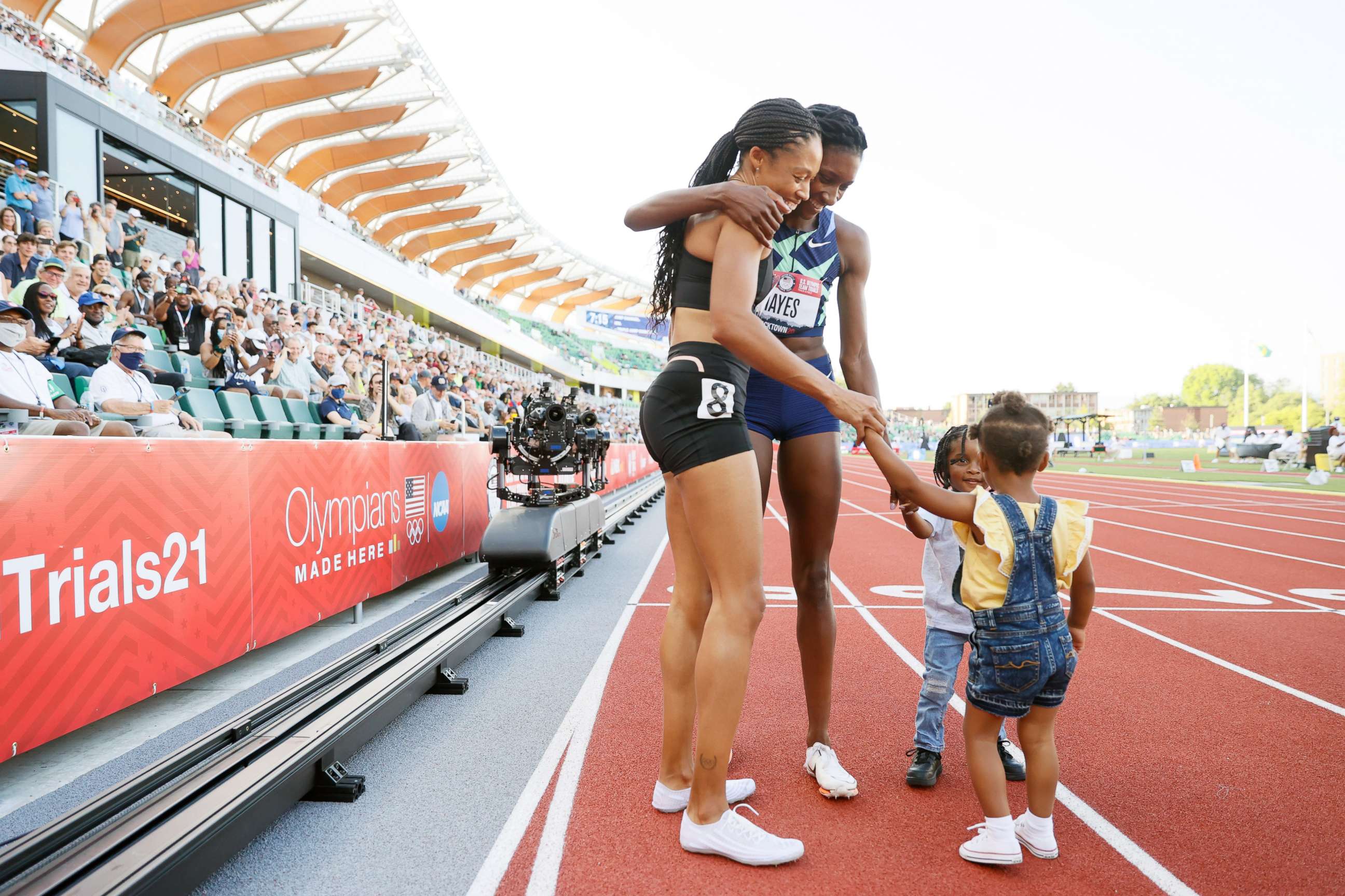 PHOTO:Allyson Felix and Quanera Hayes celebrate with their children after placing second and first respectively in the Women's 400 Meters Final on day three of the 2020 U.S. Olympic Track & Field Team Trials at Hayward Field,June 20, 2021, in Eugene, Ore.