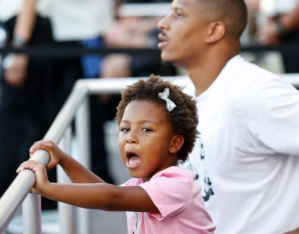 PHOTO: Kenneth Ferguson, husband of Allyson Felix, with their daughter, Camryn following the medal ceremony for the 4x400m Mixed Relay Final on day one of the World Athletics Championships Oregon22 at Hayward Field, July 15, 2022, in Eugene, Ore.