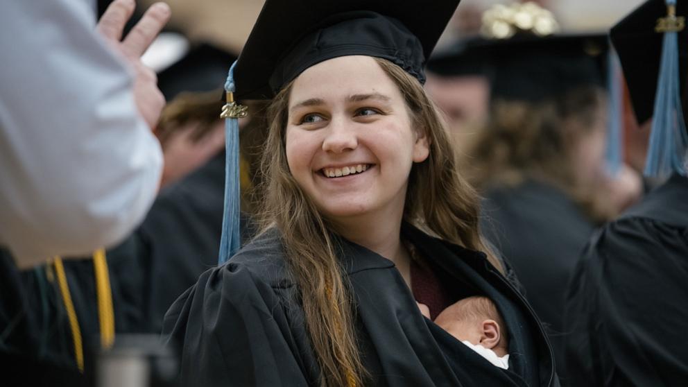 PHOTO: Grace Szymchack brought her 10-day-old daughter Annabelle with her to her Ferris State University graduation ceremony on Dec. 15, 2023.