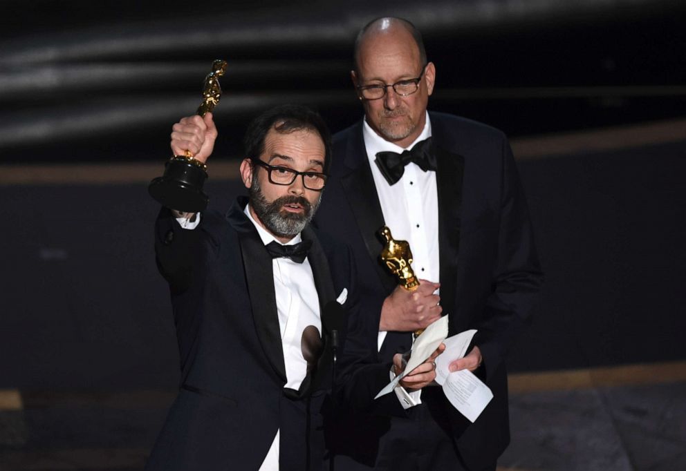 PHOTO: Andrew Buckland, left, and Michael McCusker accept the award for best film editing for "Ford v Ferrari" at the Oscars, Feb. 9, 2020, at the Dolby Theatre in Los Angeles.