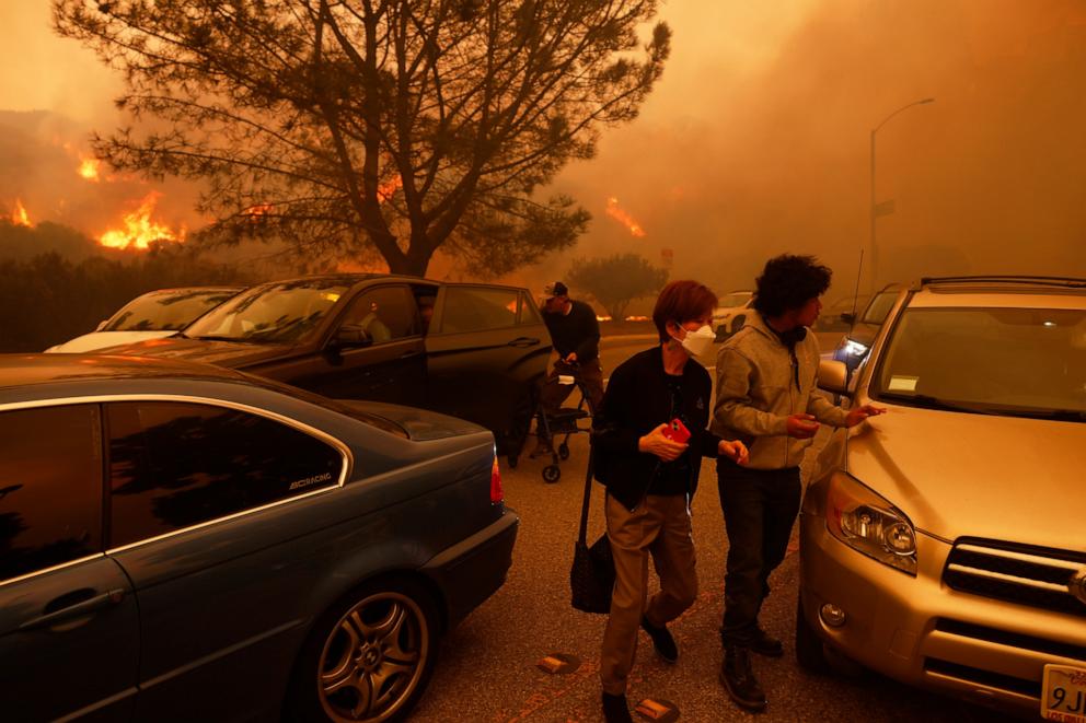 PHOTO: People flee from the advancing Palisades Fire, by car and on foot, Jan. 7, 2025, in the Pacific Palisades neighborhood of Los Angeles.