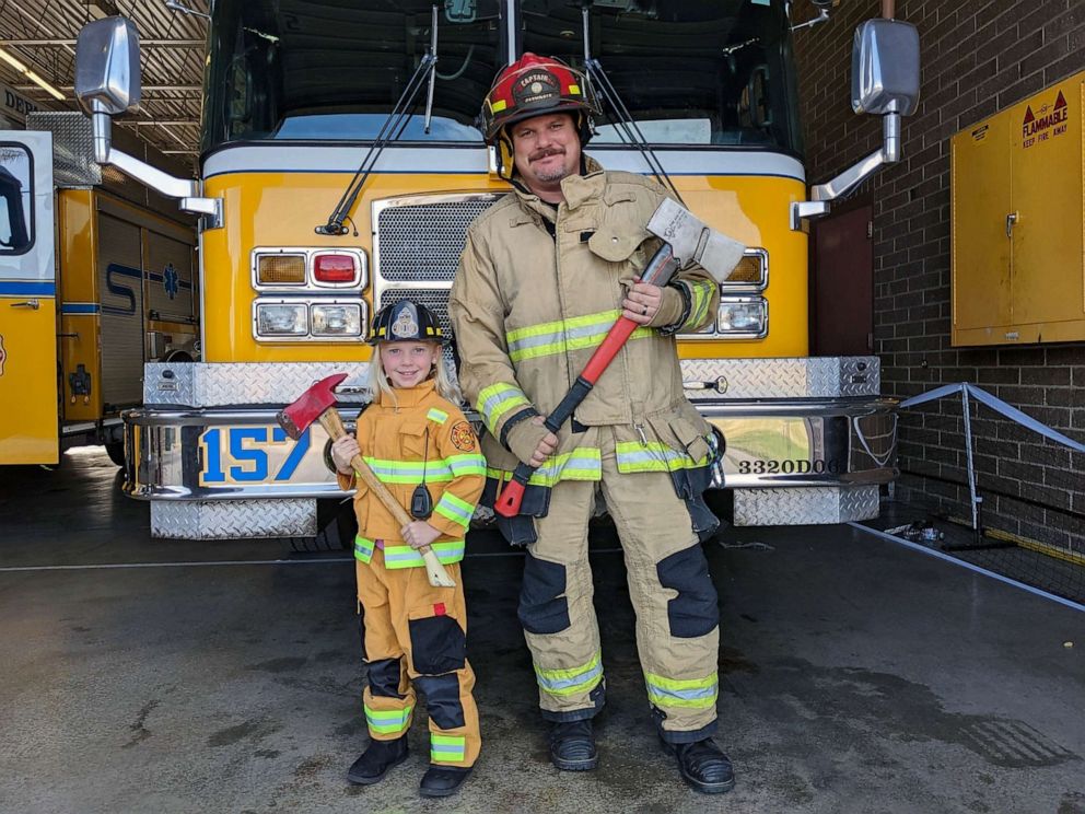 PHOTO: Glendale Fire Department Capt. Dave Colson poses with one of his four children